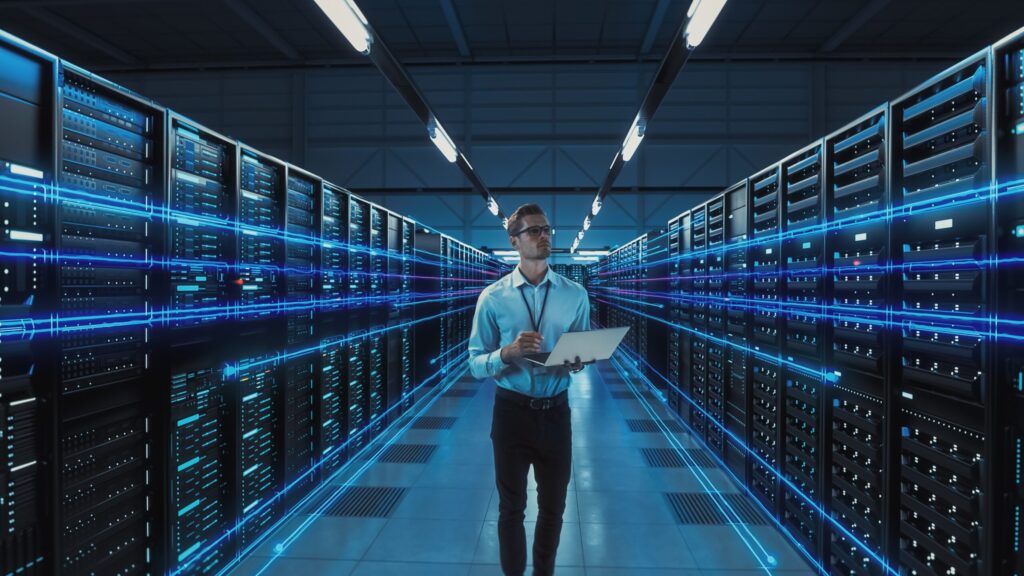 Futuristic,Concept:,Data,Center,Chief,Technology,Officer,Holding,Laptop,,Standing